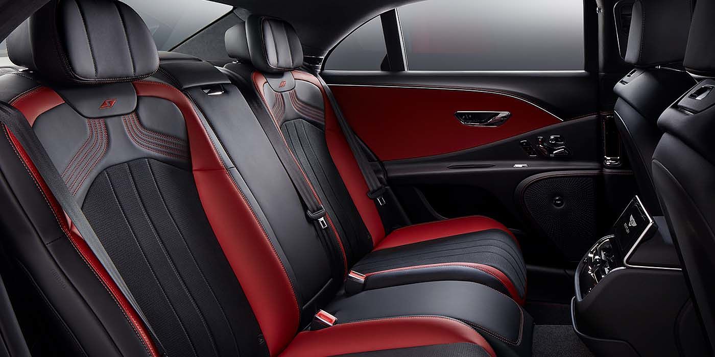 Bentley Knokke Bentley Flying Spur S sedan rear interior in Beluga black and Hotspur red hide with S stitching