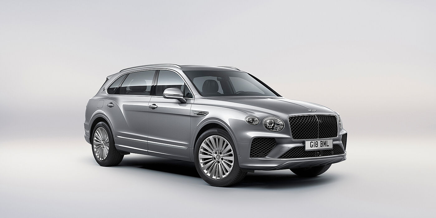 Bentley Knokke Bentley Bentayga Extended Wheelbase luxury SUV front three quarter view in Moonbeam paint with 21 inch five spoke painted wheels