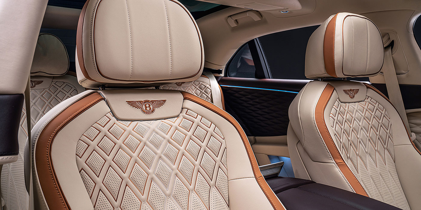 Bentley Knokke Bentley Flying Spur Odyssean sedan rear seat detail with Diamond quilting and Linen and Burnt Oak hides