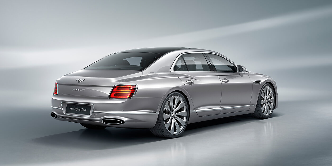 Bentley Knokke New Bentley Flying Spur sedan rear view in Silverlake paint with ten spoke wheels and chrome matrix grille